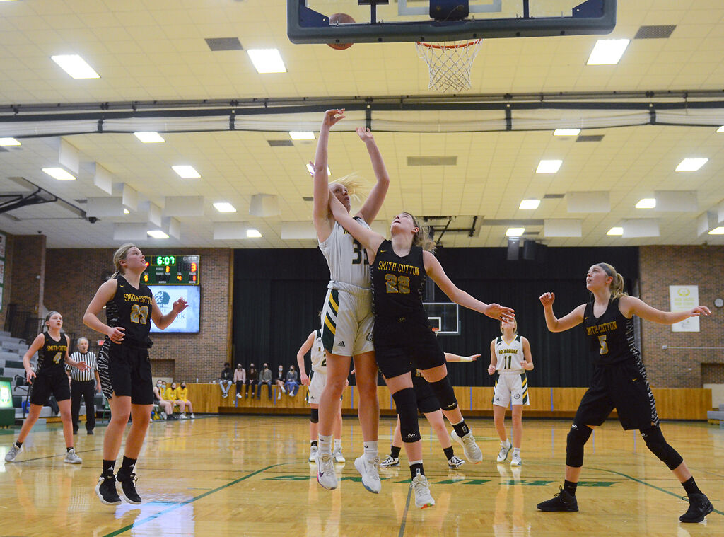 Kyrah Brodie shoots around Bailey Brown